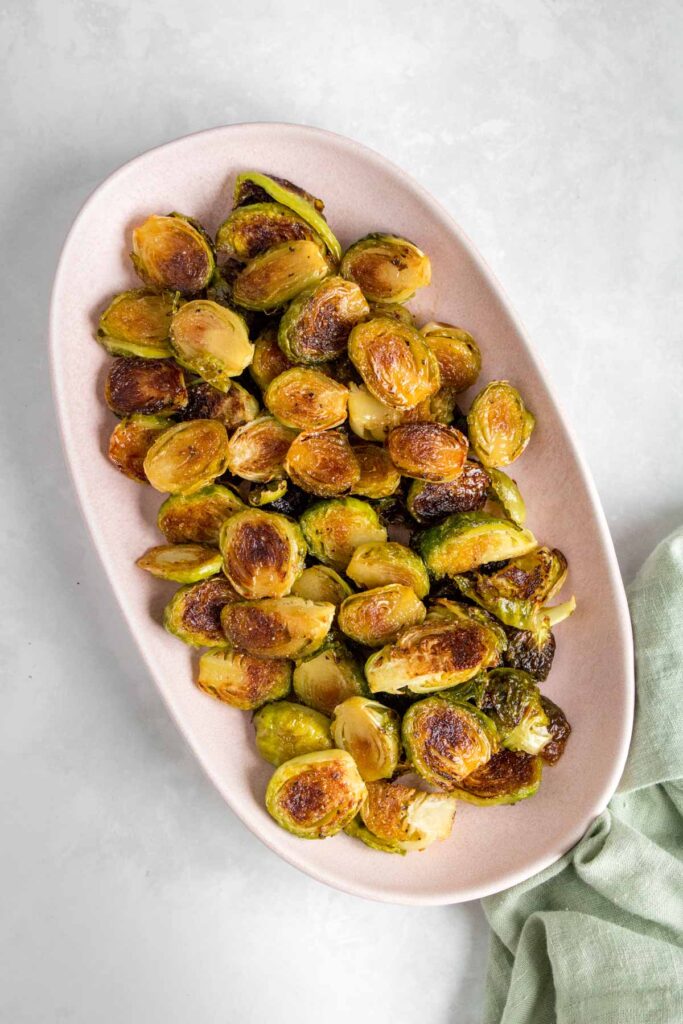 Maple glazed brussels sprouts in a platter.