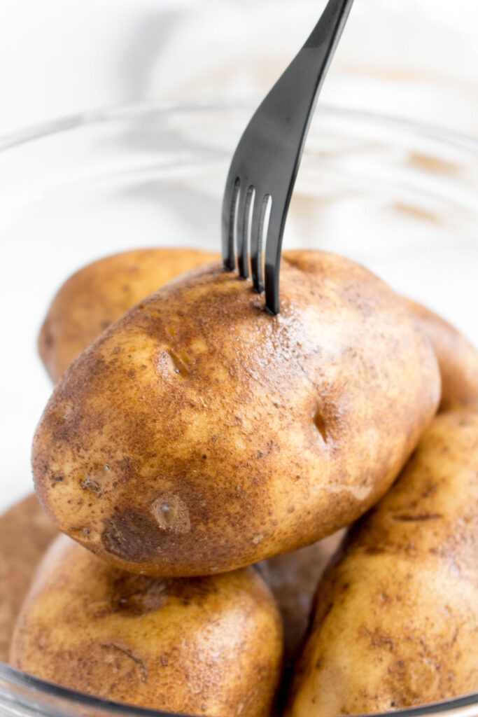 Potatoes pricked with a fork.
