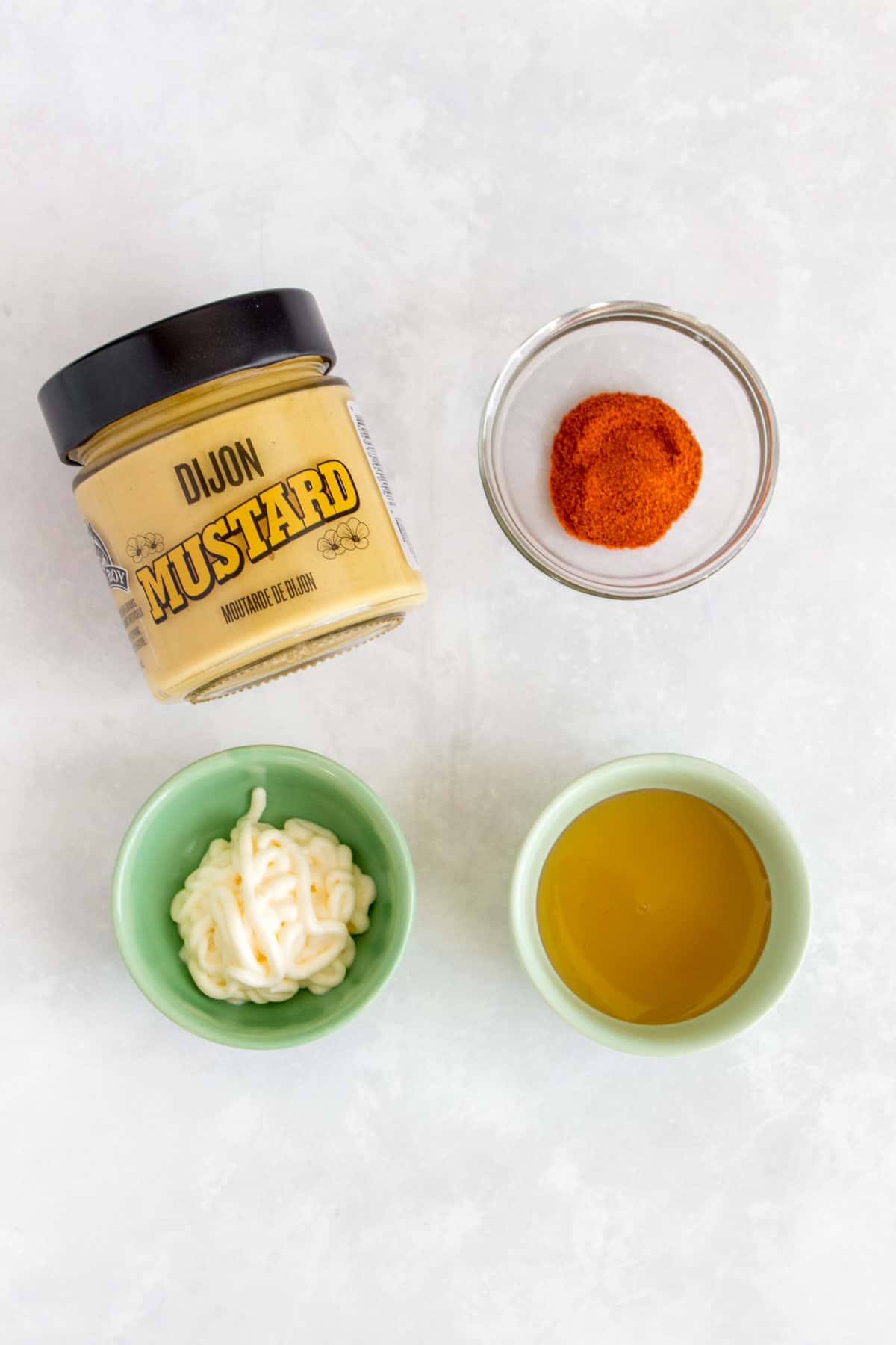 Overhead view of ingredients needed to make honey mustard sauce.