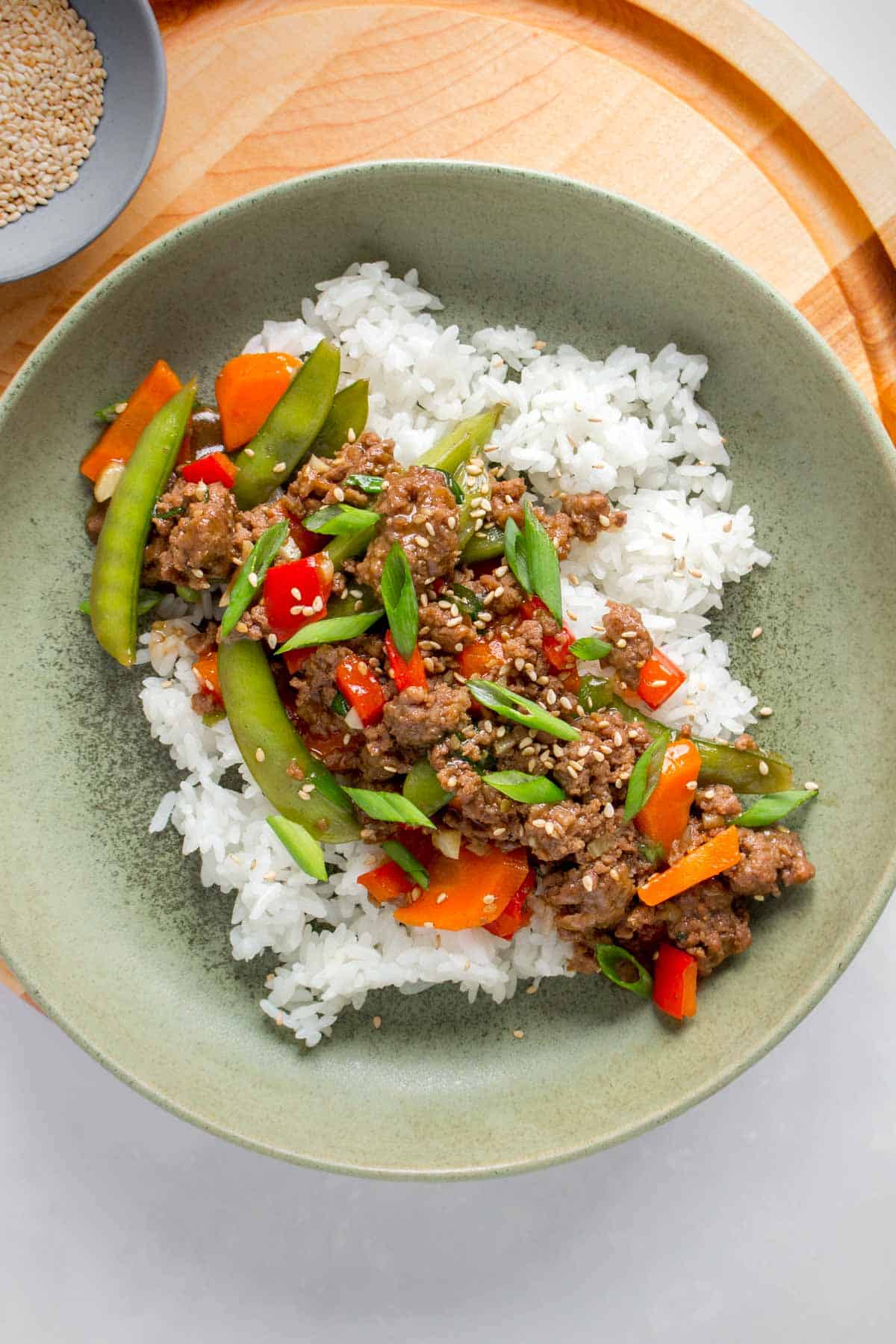 A plate of rice and beef stir fry.