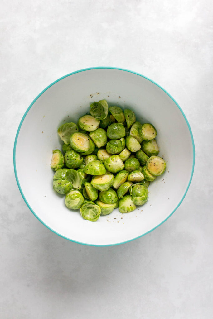 Seasoned brussels sprouts in a bowl.