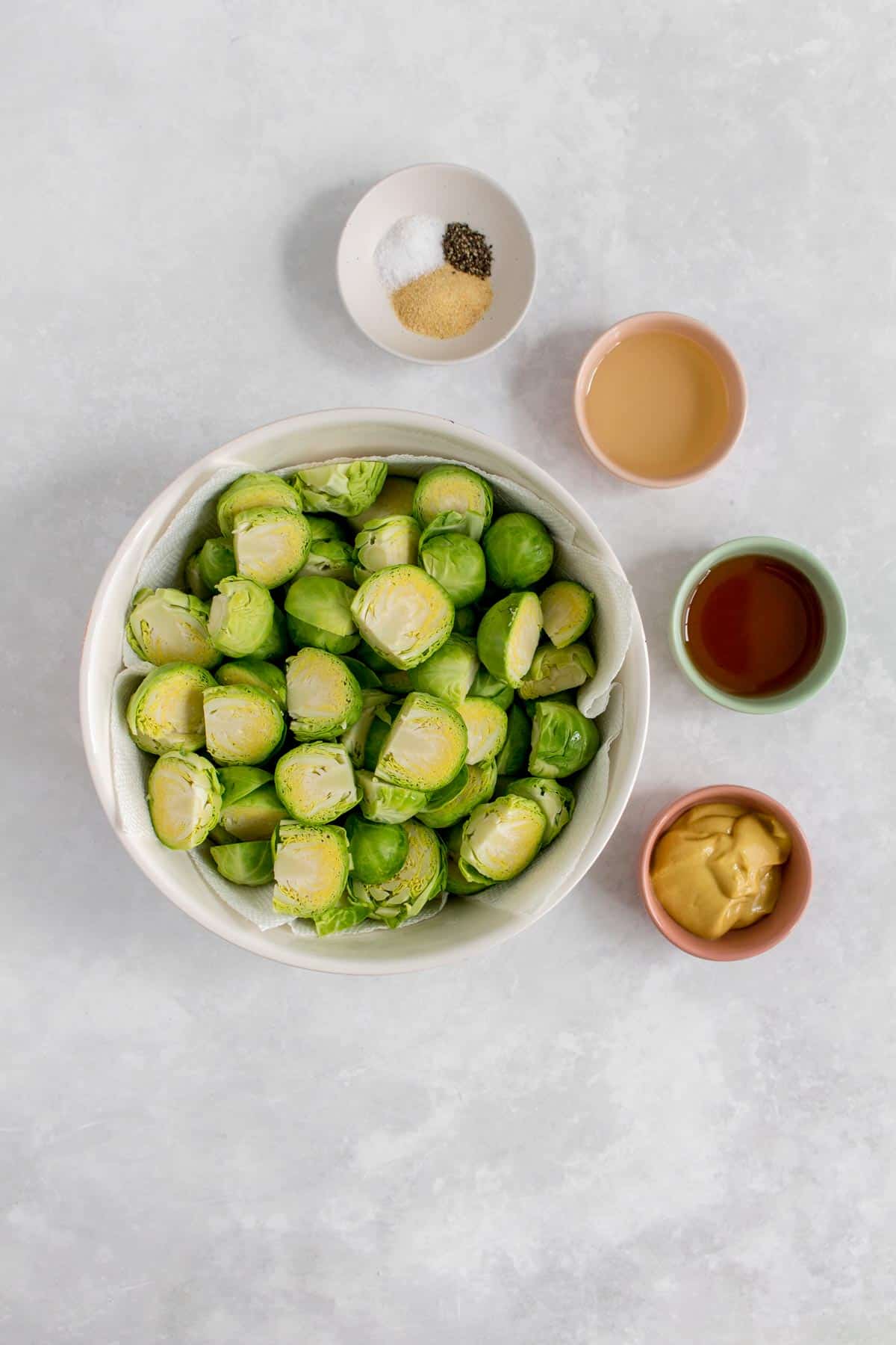 Ingredients needed to make maple mustard brussels sprouts.