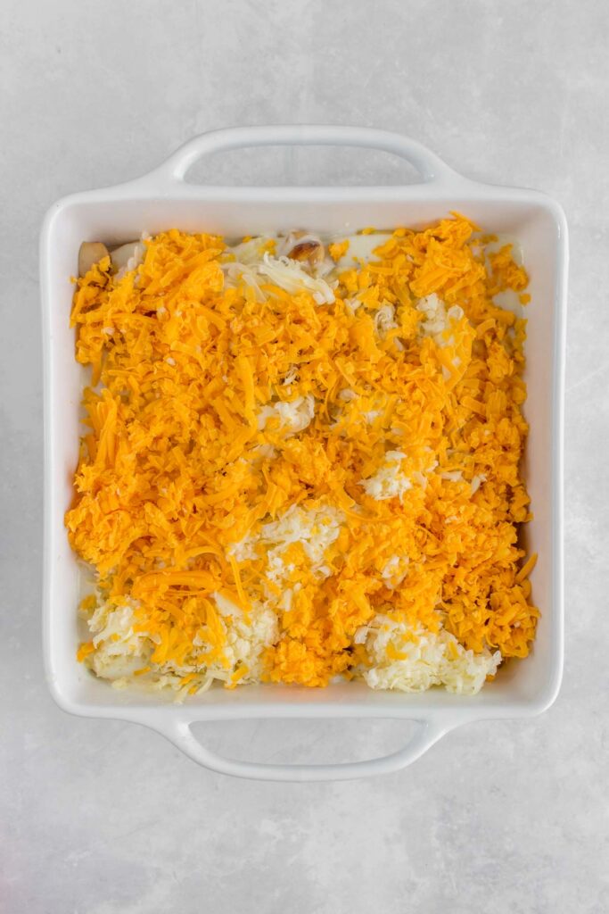 Cheese added to the baking dish.