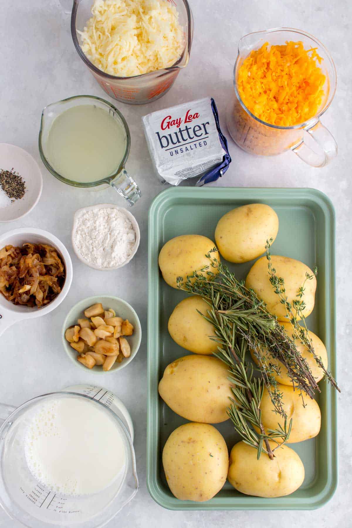 Ingredients needed to make potatoes au gratin.