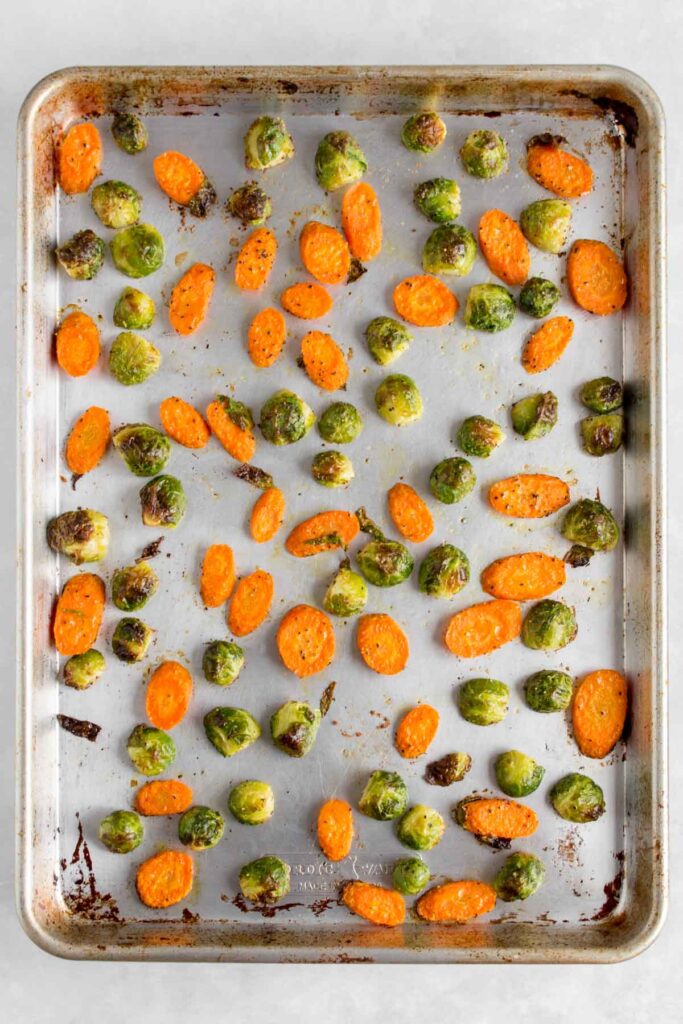 A pan of roasted brussels sprouts and carrots.