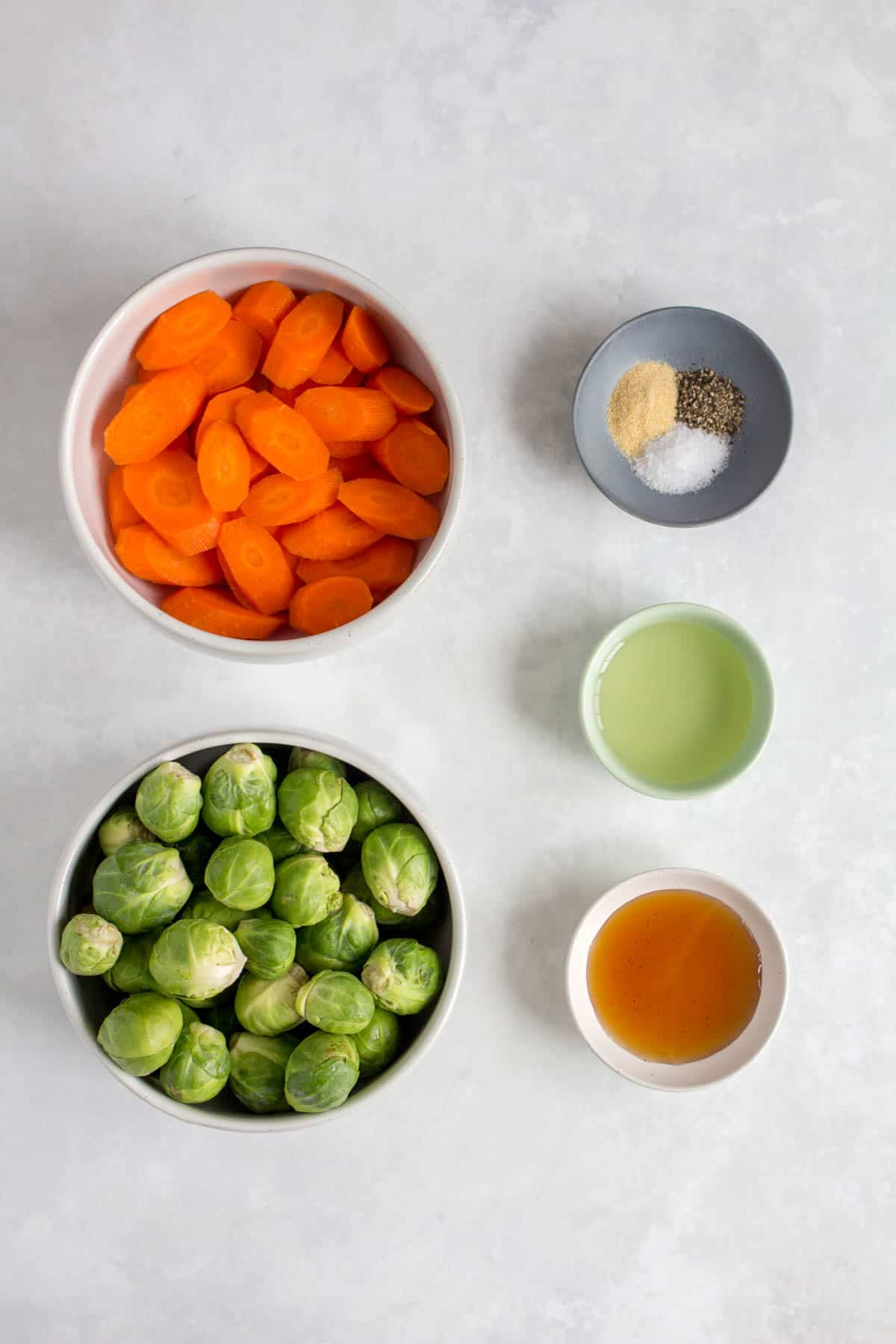 Ingredients needed to make roasted brussels sprouts and carrots.