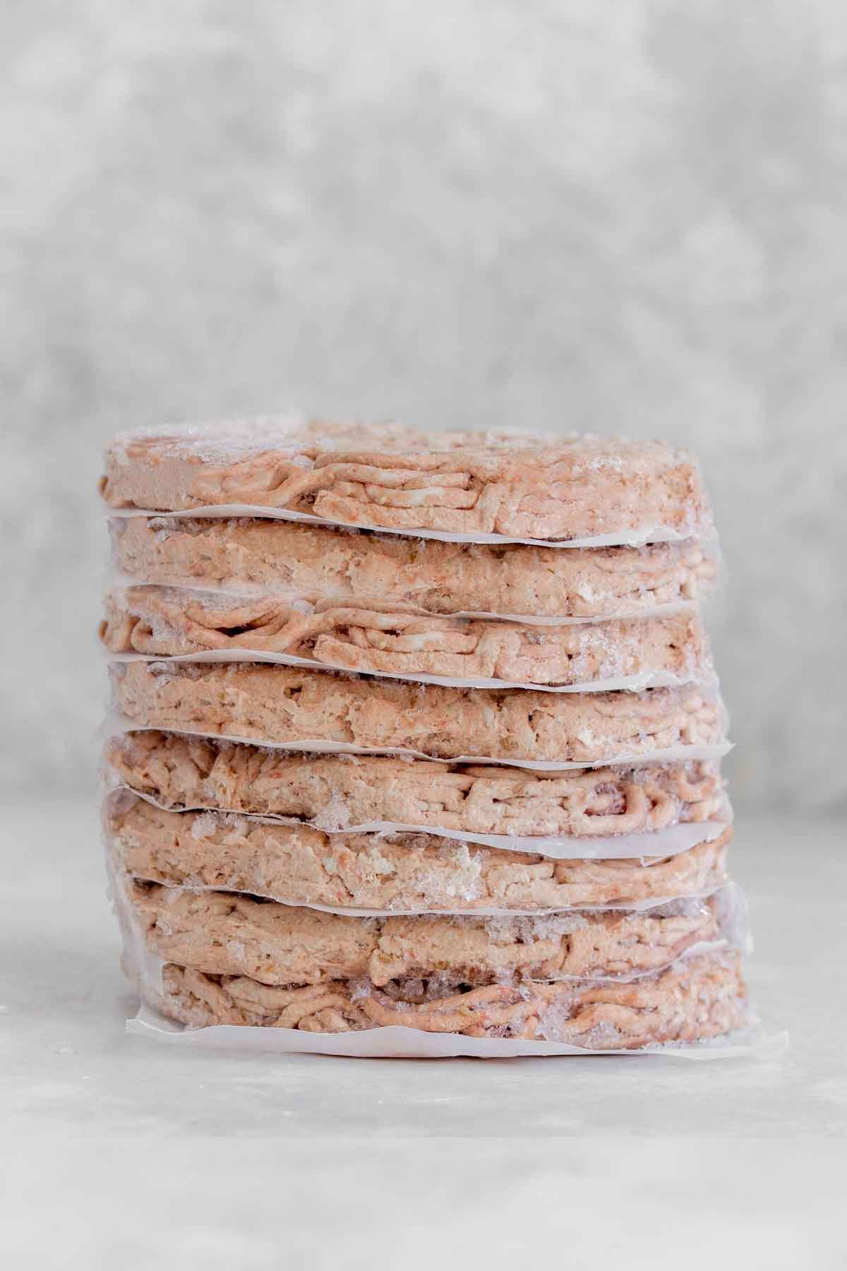 A stack of frozen burger patties.
