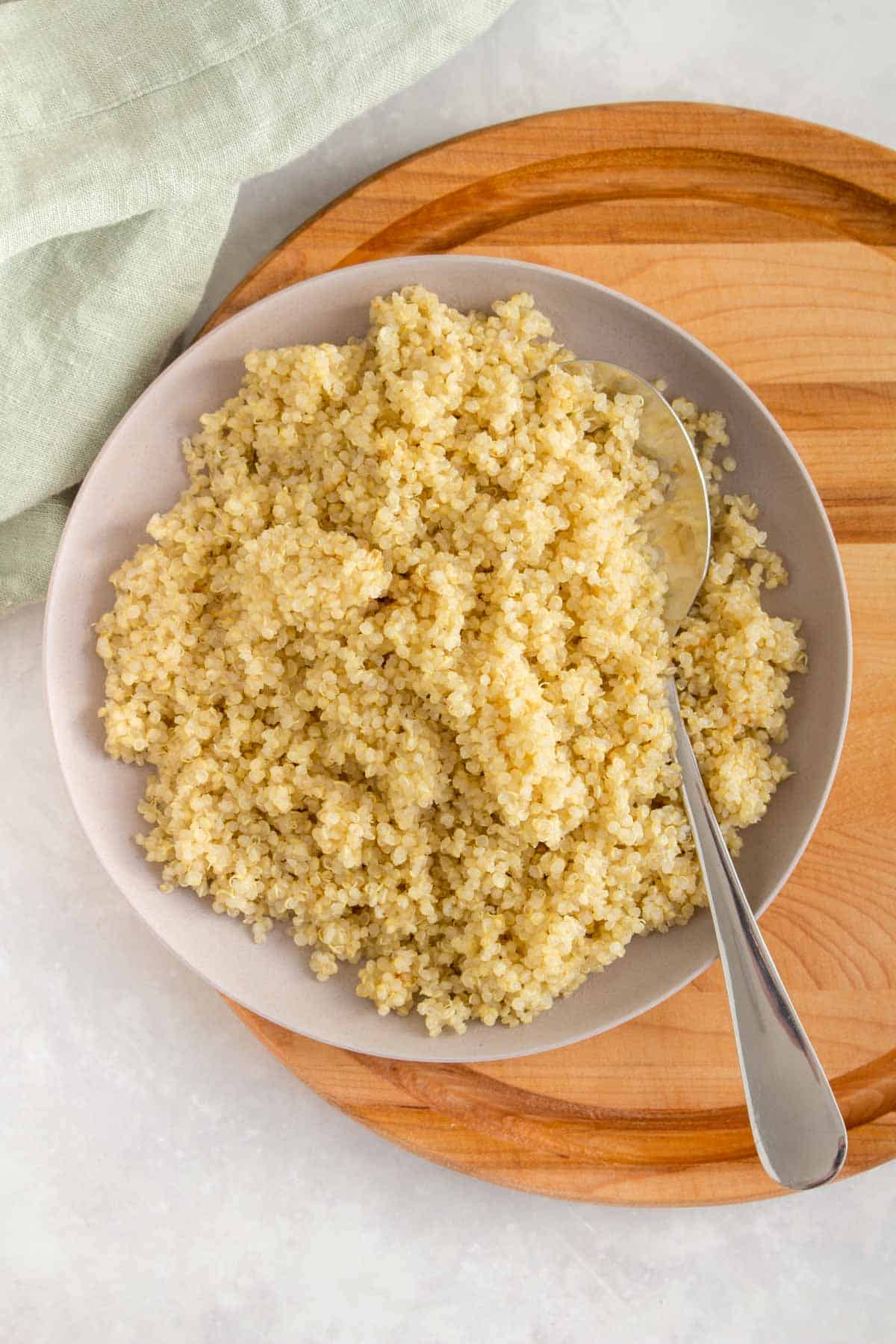 A plate of quinoa with a spoon.