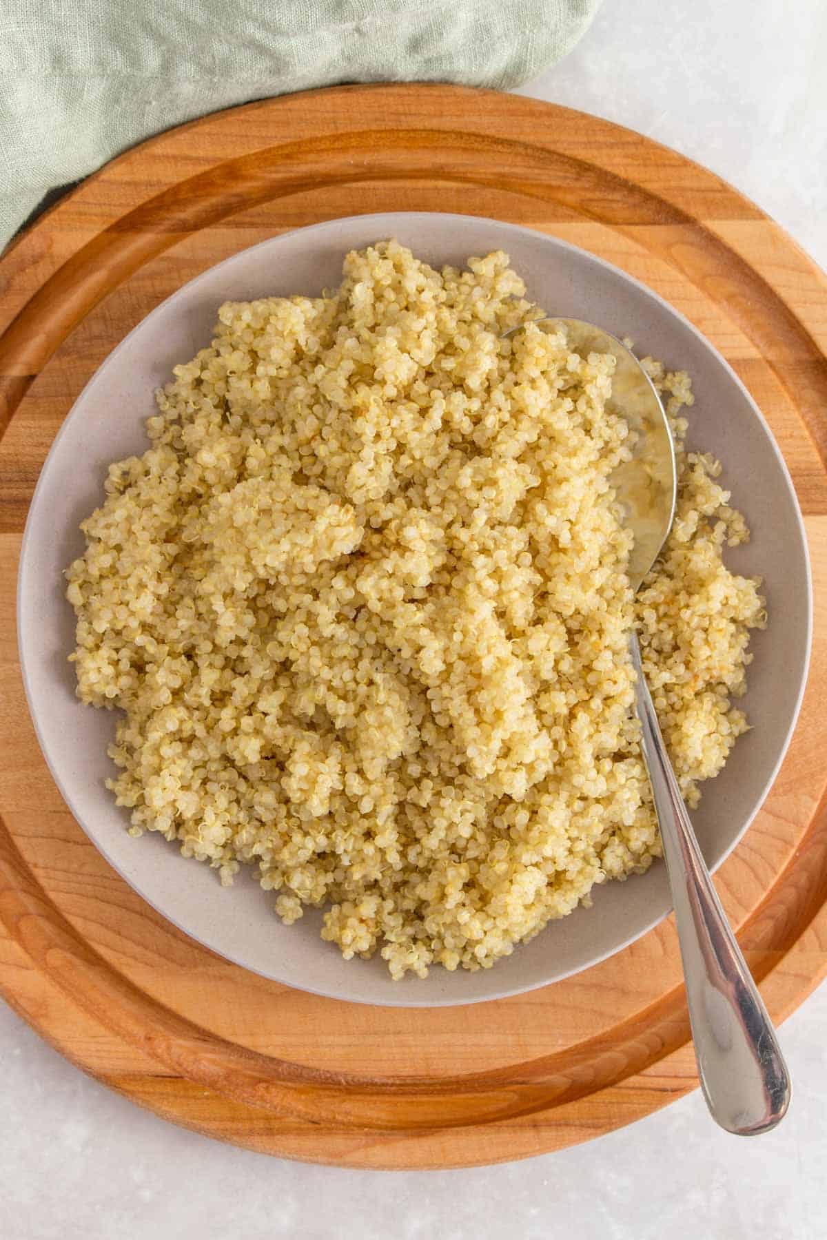 A plate of quinoa with a spoon.