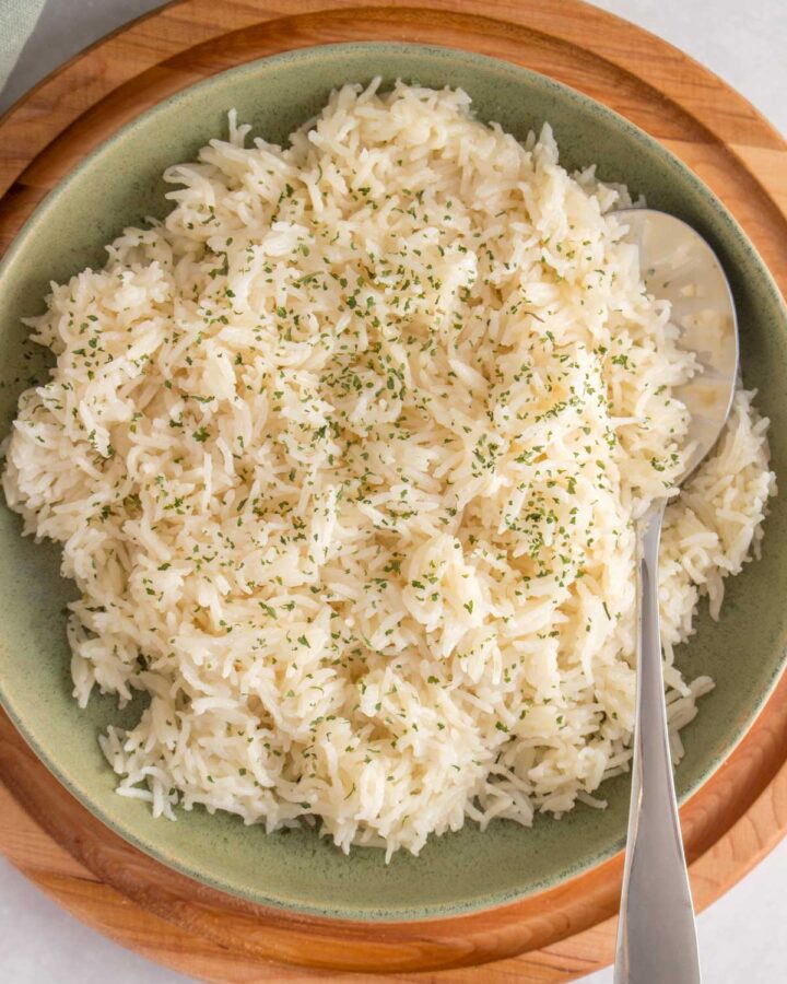 Close up of a plate of instant pot basmati rice with a spoon.