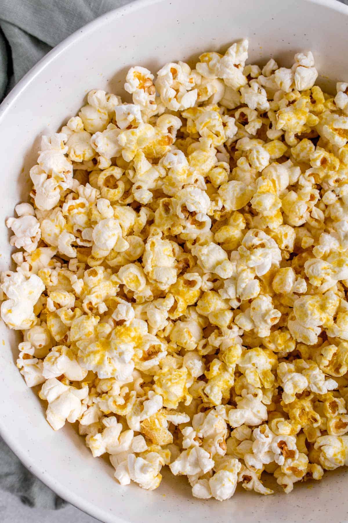 Close up of a bowl of nutritional yeast popcorn.