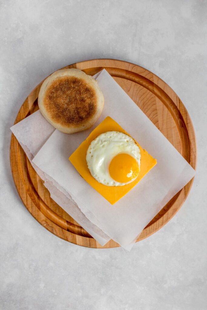 Fried egg on top of the cheese.
