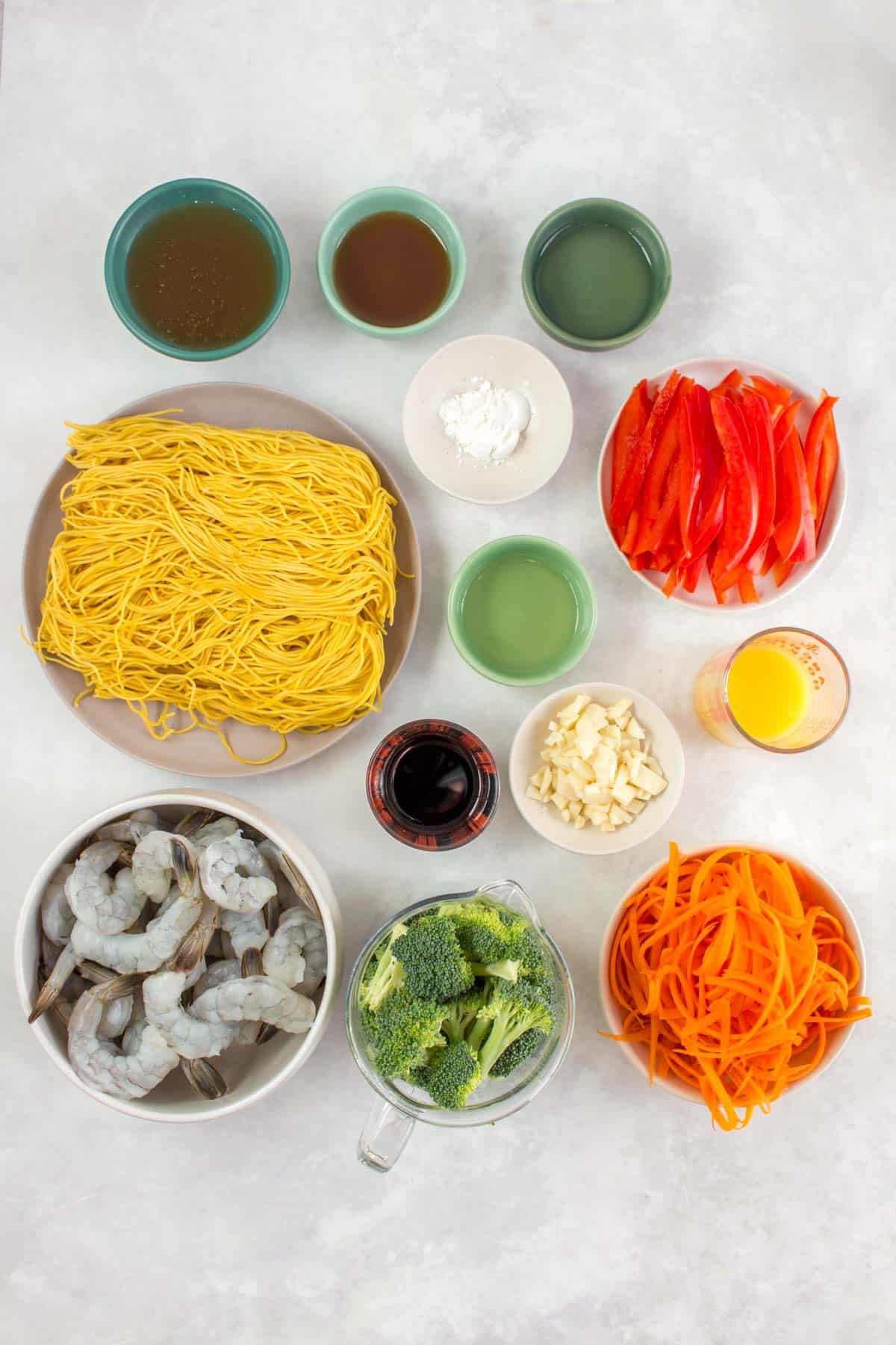 Ingredients needed to make shrimp and noodles stir fry.