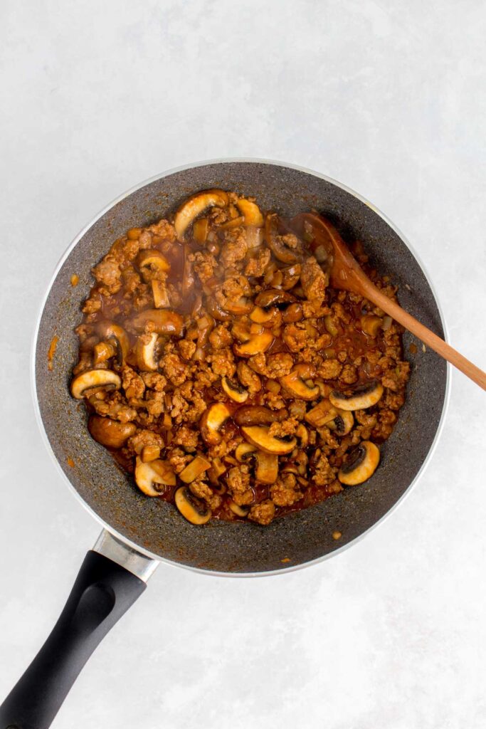 A pan pork stir fry with mushrooms.