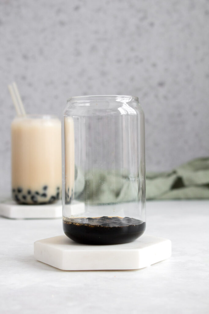 Tapioca with brown sugar syrup in a glass.
