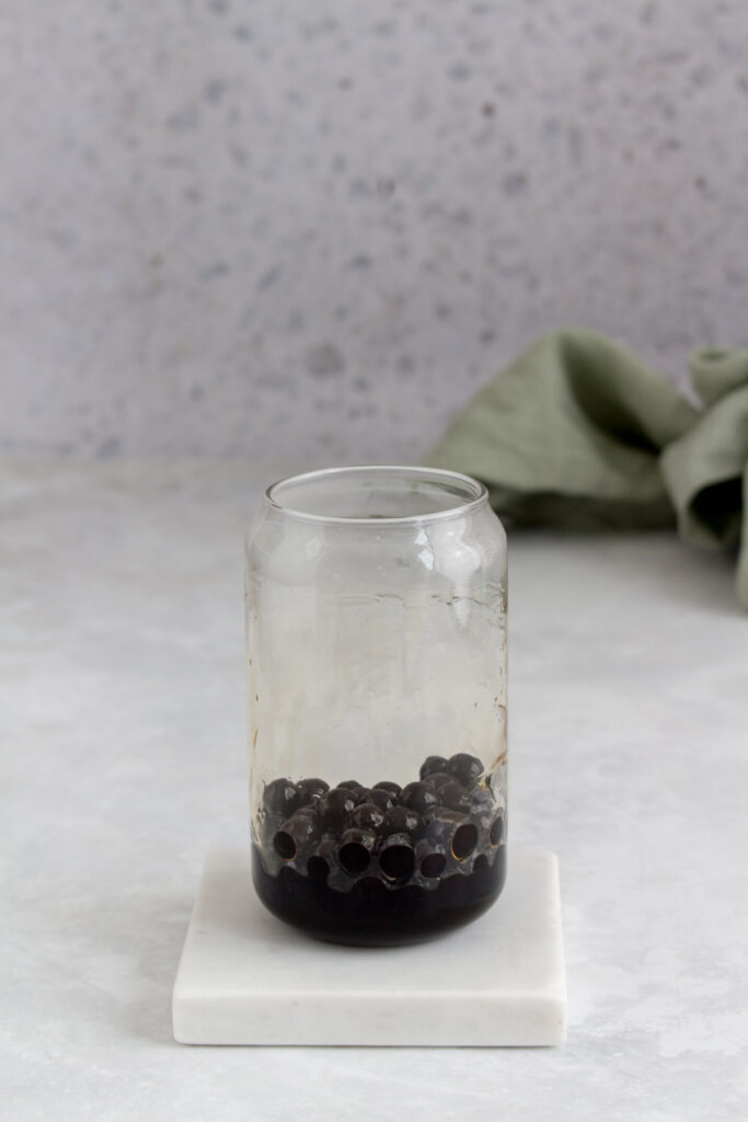 Glass with tapioca with brown sugar syrup.