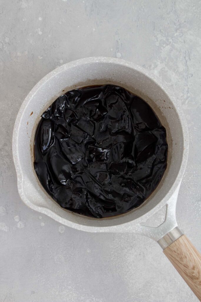 Grass jelly cooked with brown sugar syrup.