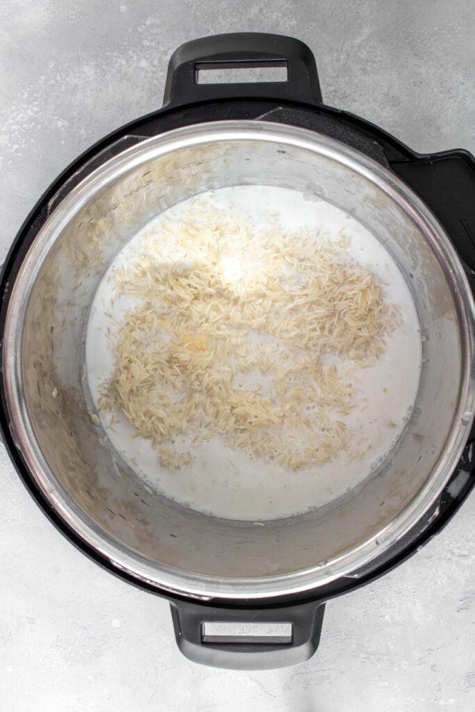A pot with coconut milk and rice.