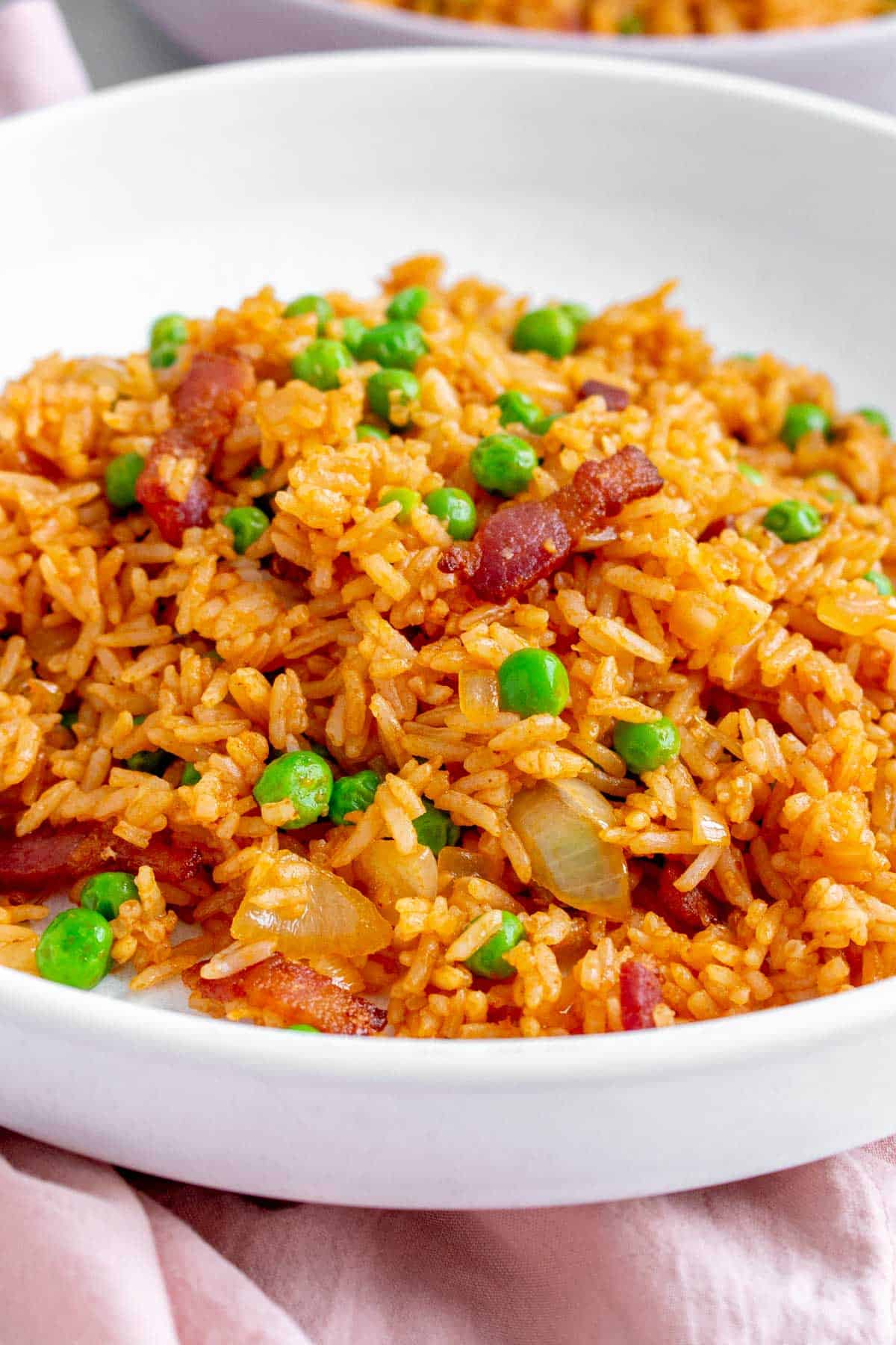 Close up of a plate of ketchup fried rice.
