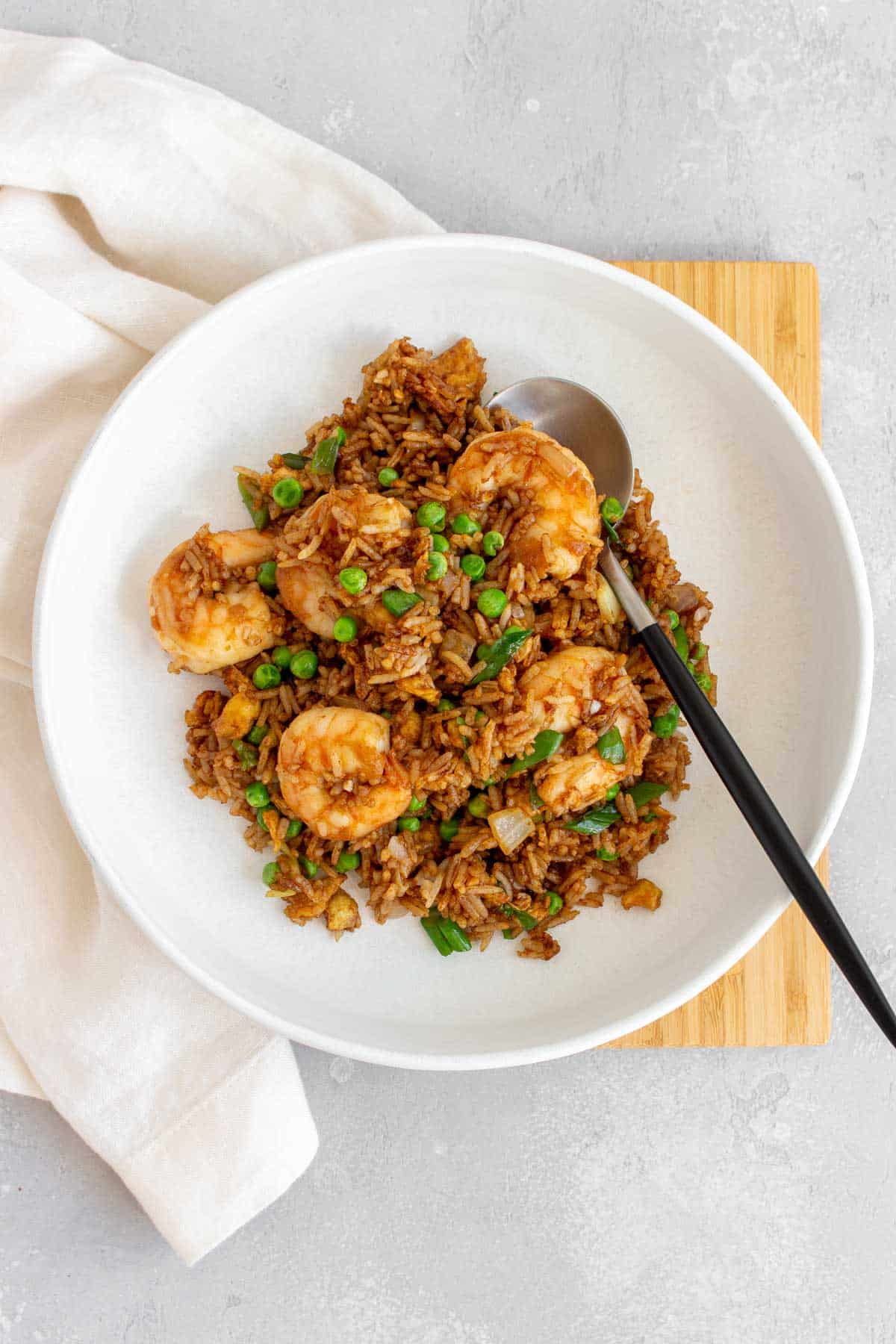 A plate with shrimp fried rice.