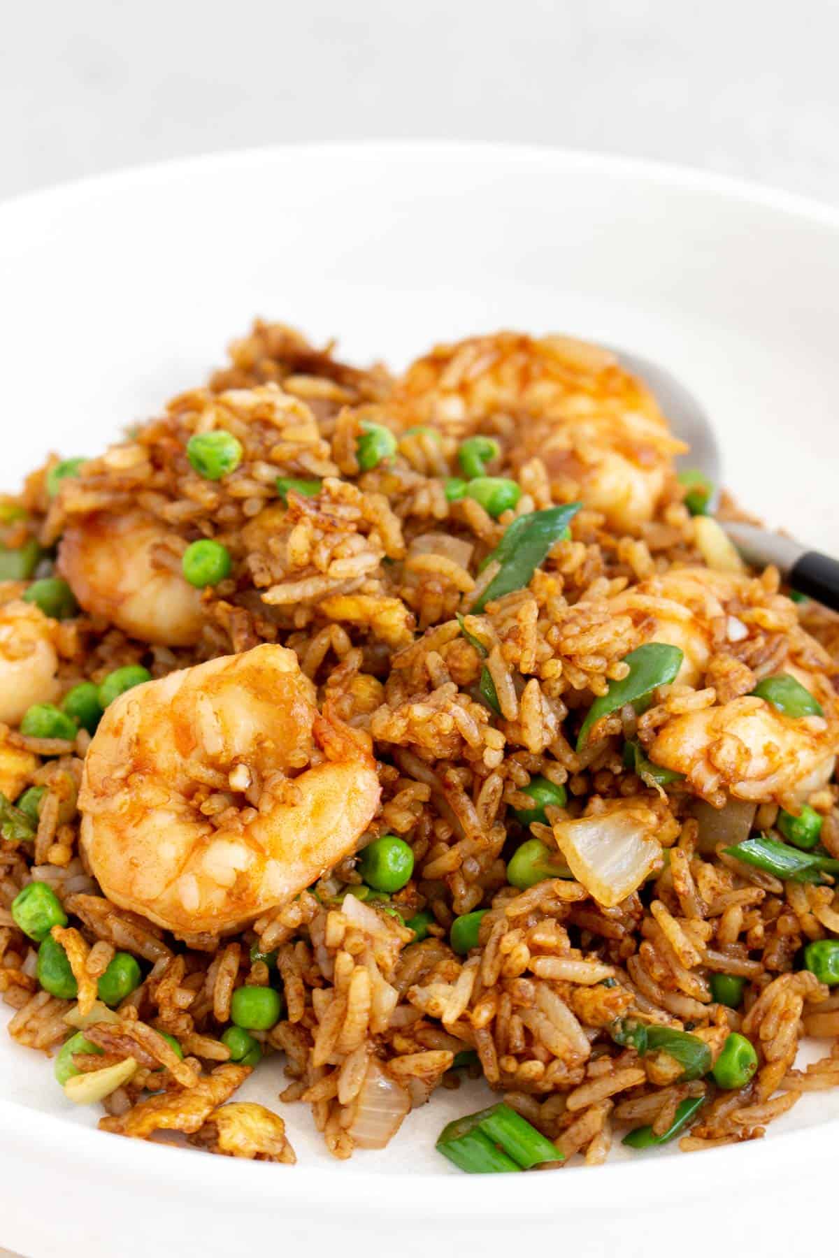 A plate of shrimp fried rice.