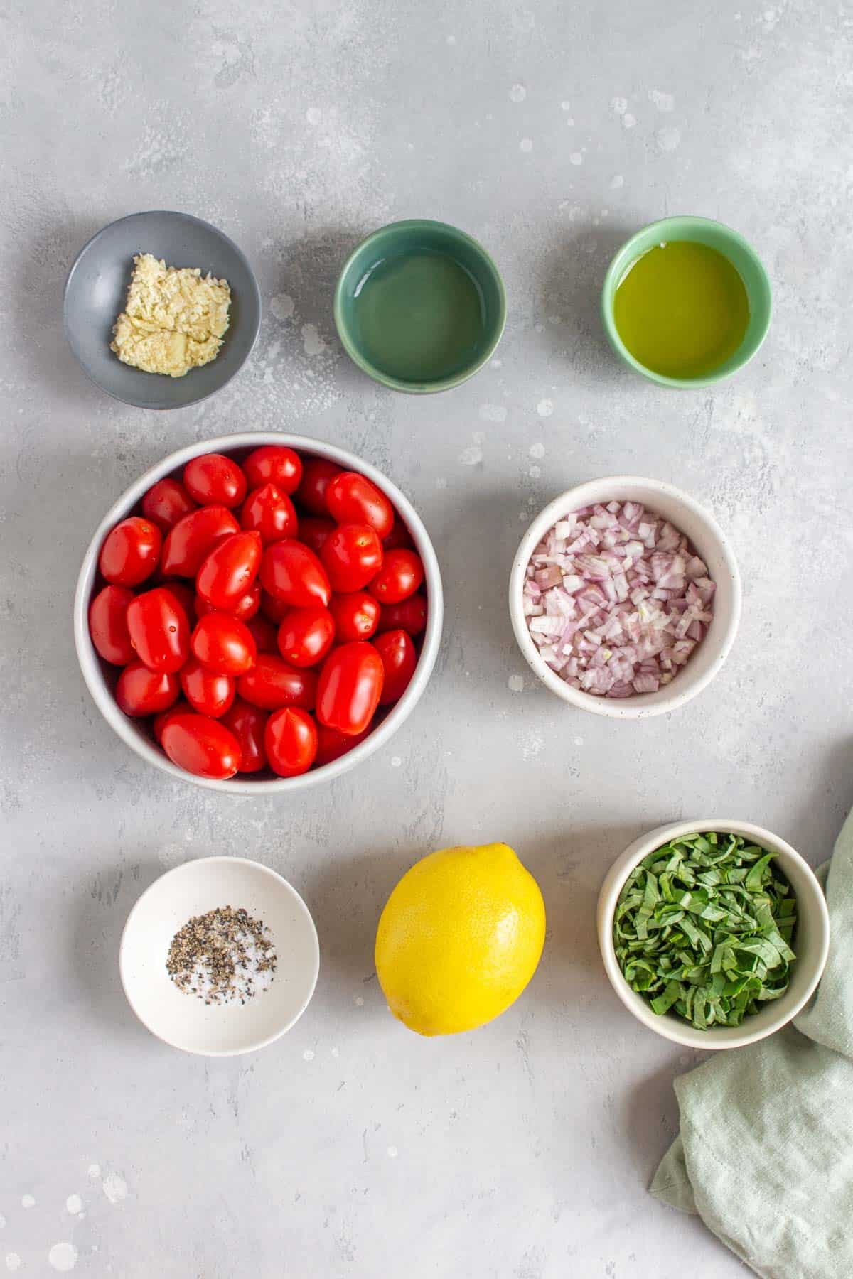 Ingredients needed to make marinated tomatoes.
