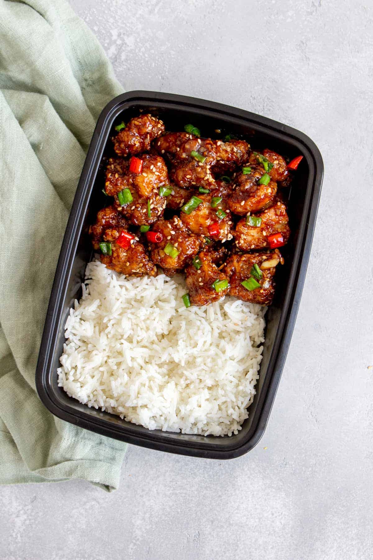 A meal prep container with Mongolian chicken and rice.