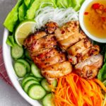 Close up of air fryer lemongrass chicken over noodles.