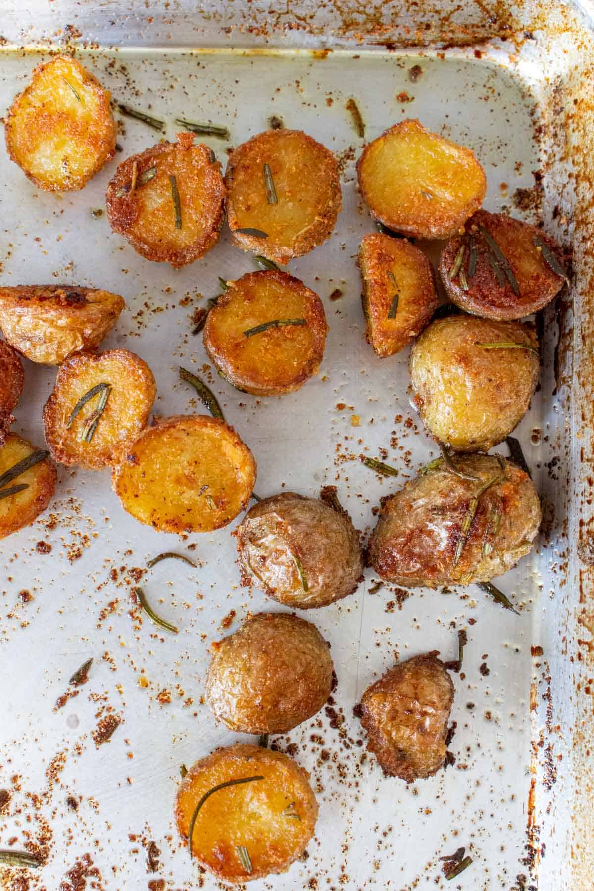 Crispy rosemary potatoes on a sheet pan.