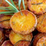 Close up of a crispy rosemary potatoes.