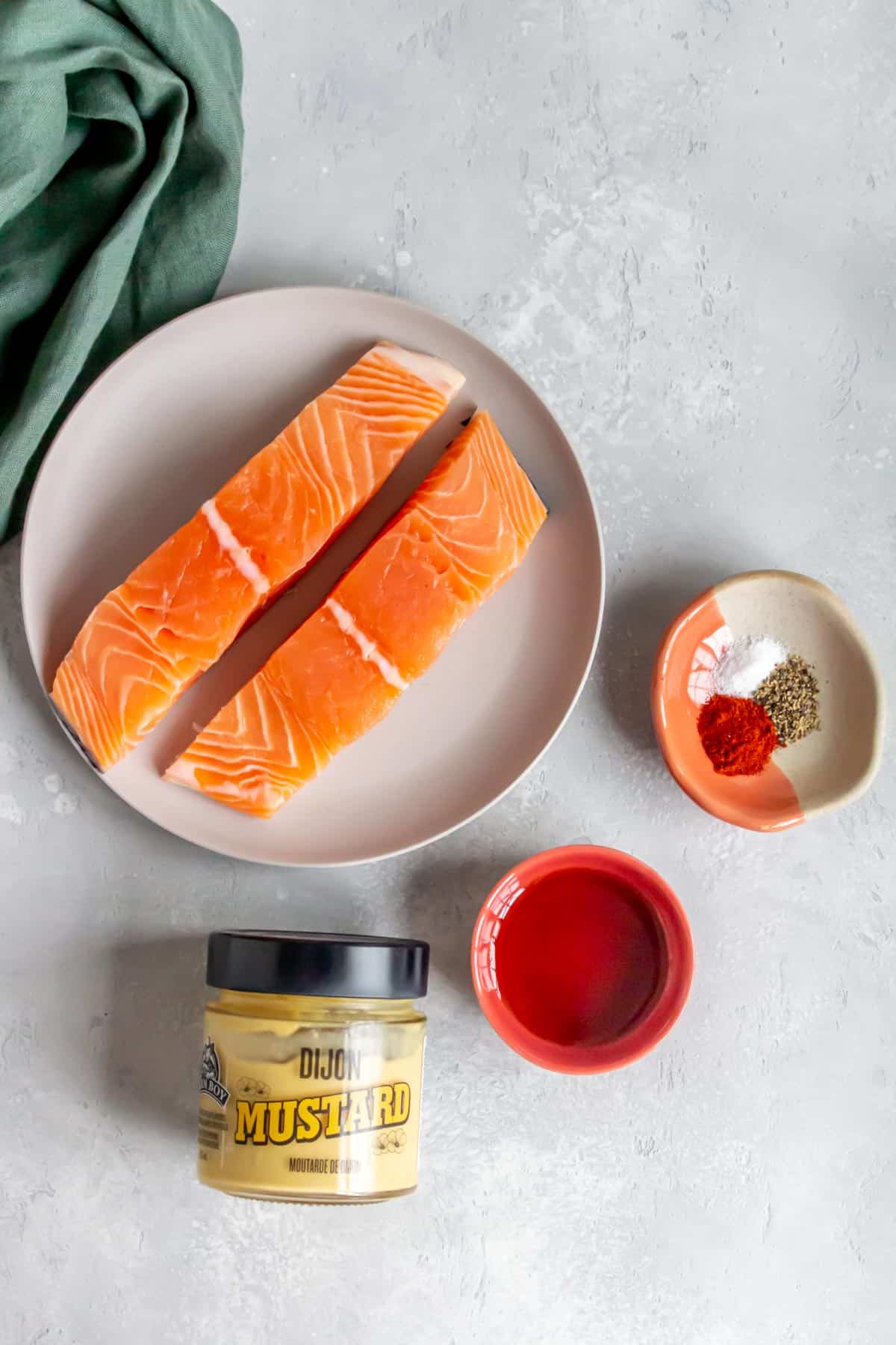 Ingredients needed to make air fryer salmon with maple dijon.