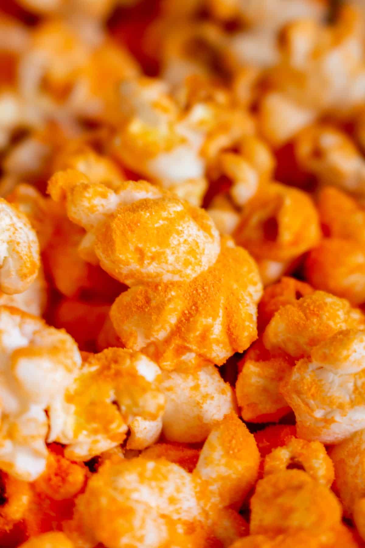 Close up view of cheddar popcorn.