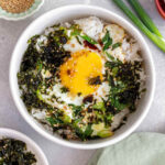 Overhead view of a bowl of scallion gyeran bap.