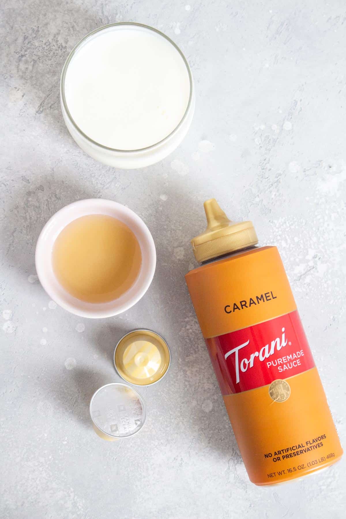 Ingredients on how tomake an iced caramel latte.