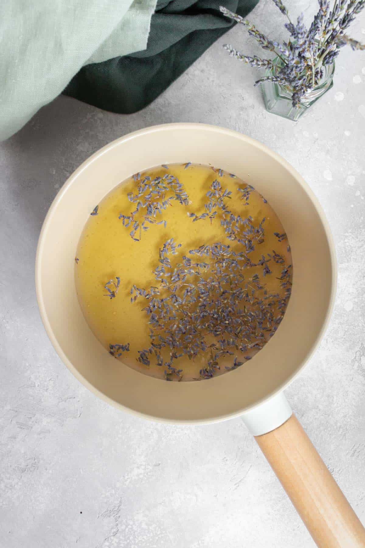 Overhead view of honey lavender syrup before cooking in a saucepan.
