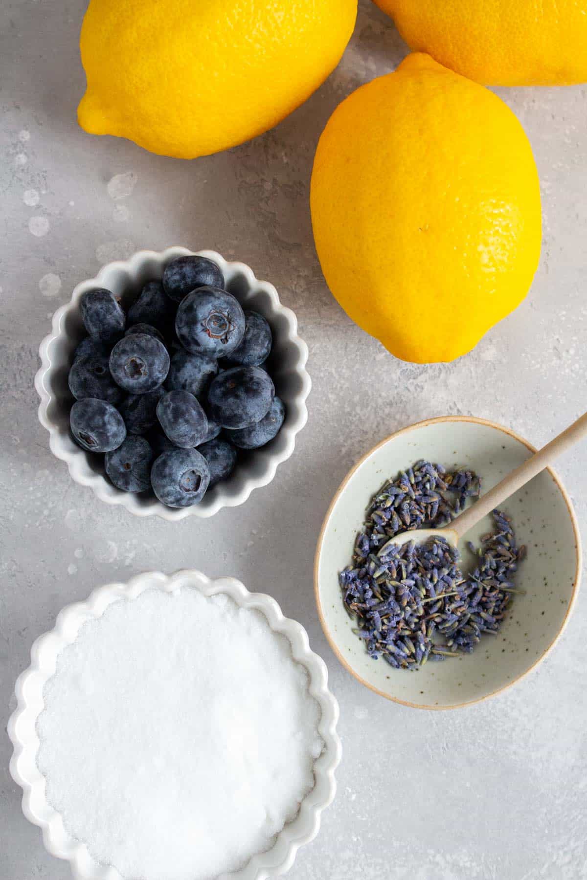 Ingredients needed to make blueberry lavender lemonade.