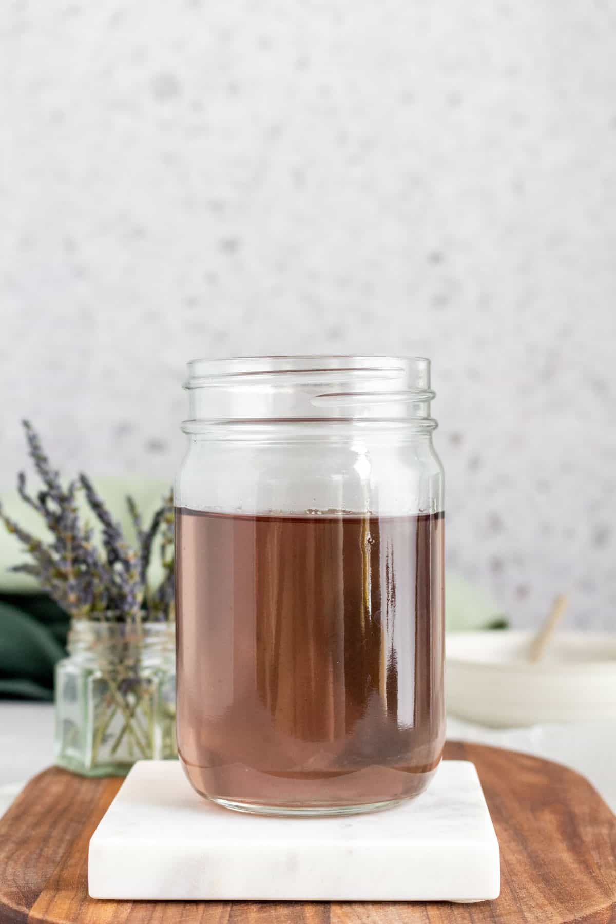 A mason jar of lavender simple syrup.