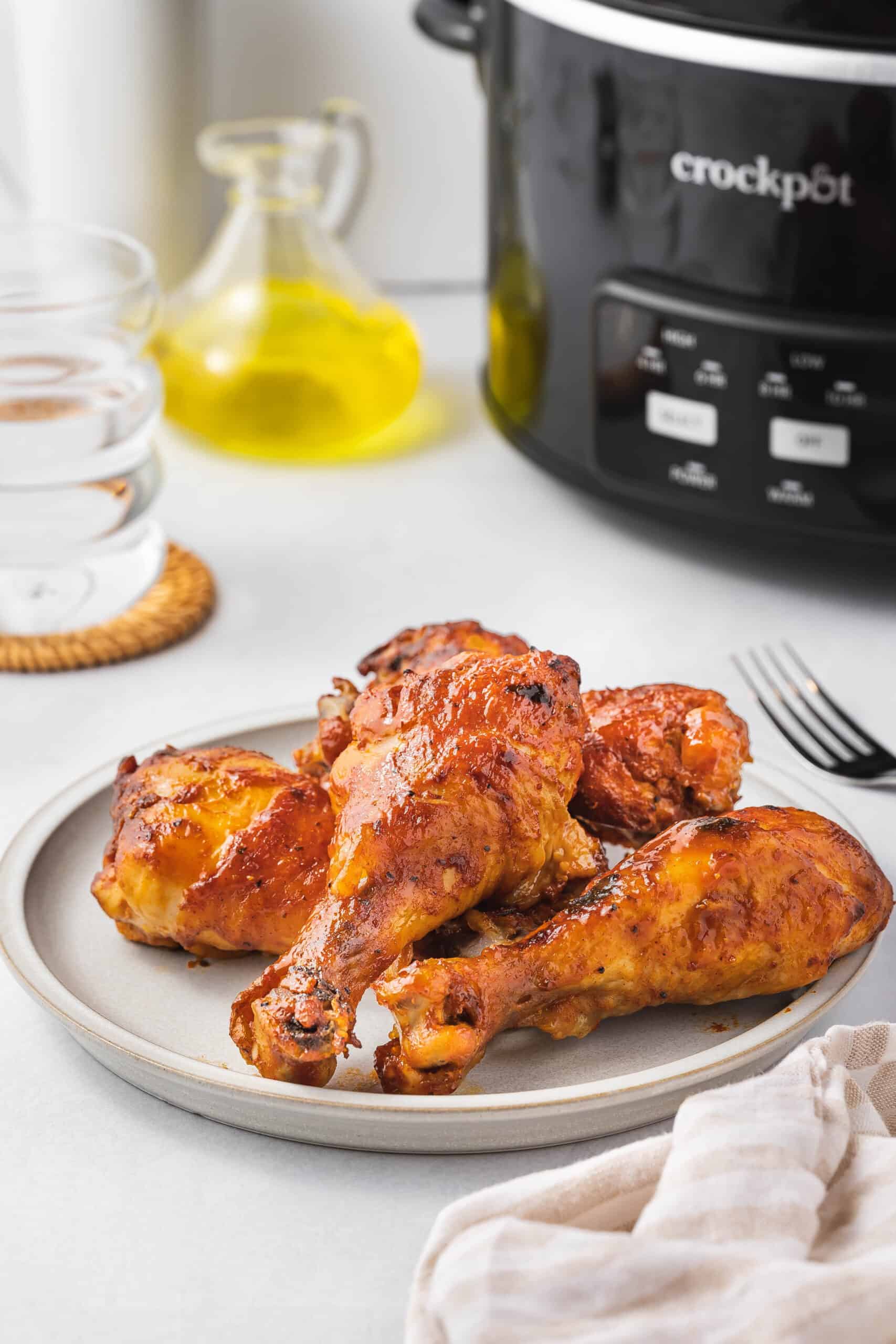 A plate of slow cooker drumsticks. 