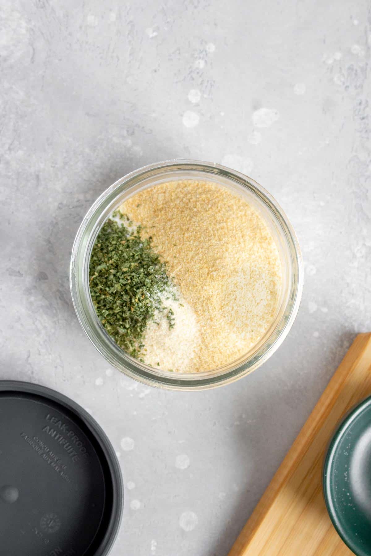 Ingredients for garlic salt in a small container.