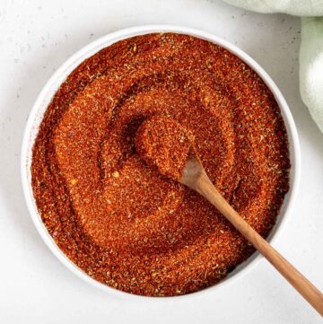 Taco seasoning without salt in a plate, mixed with a spoon.