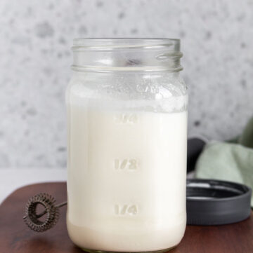 A mason jar of vanilla sweet cream cold foam.