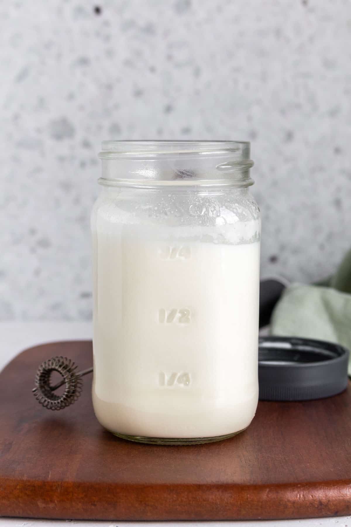A mason jar of vanilla sweet cream cold foam.