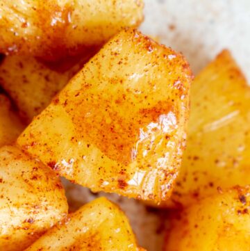 Close up view of air fryer pineapples chunks.