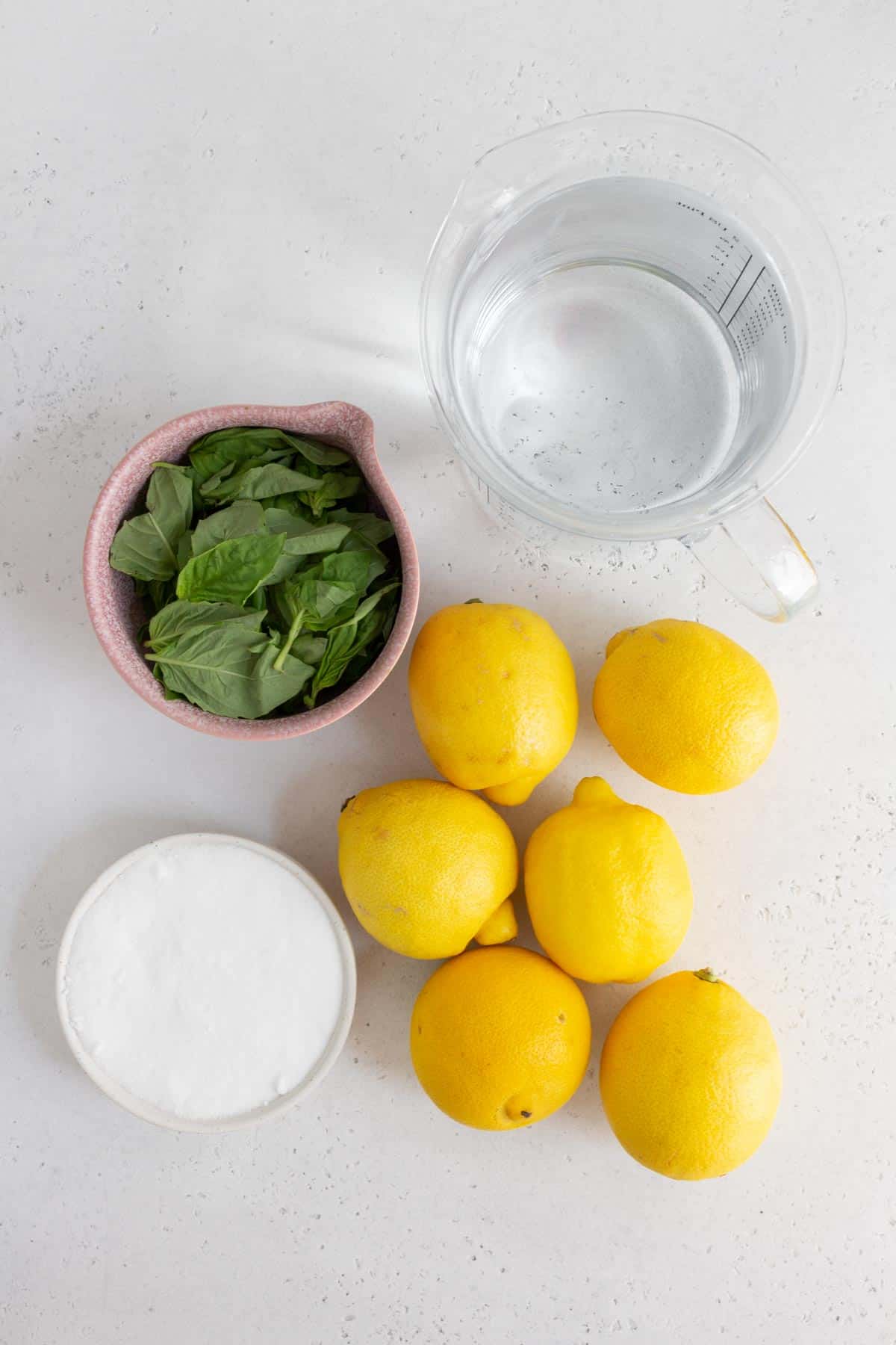Ingredients needed to make basil lemonade.