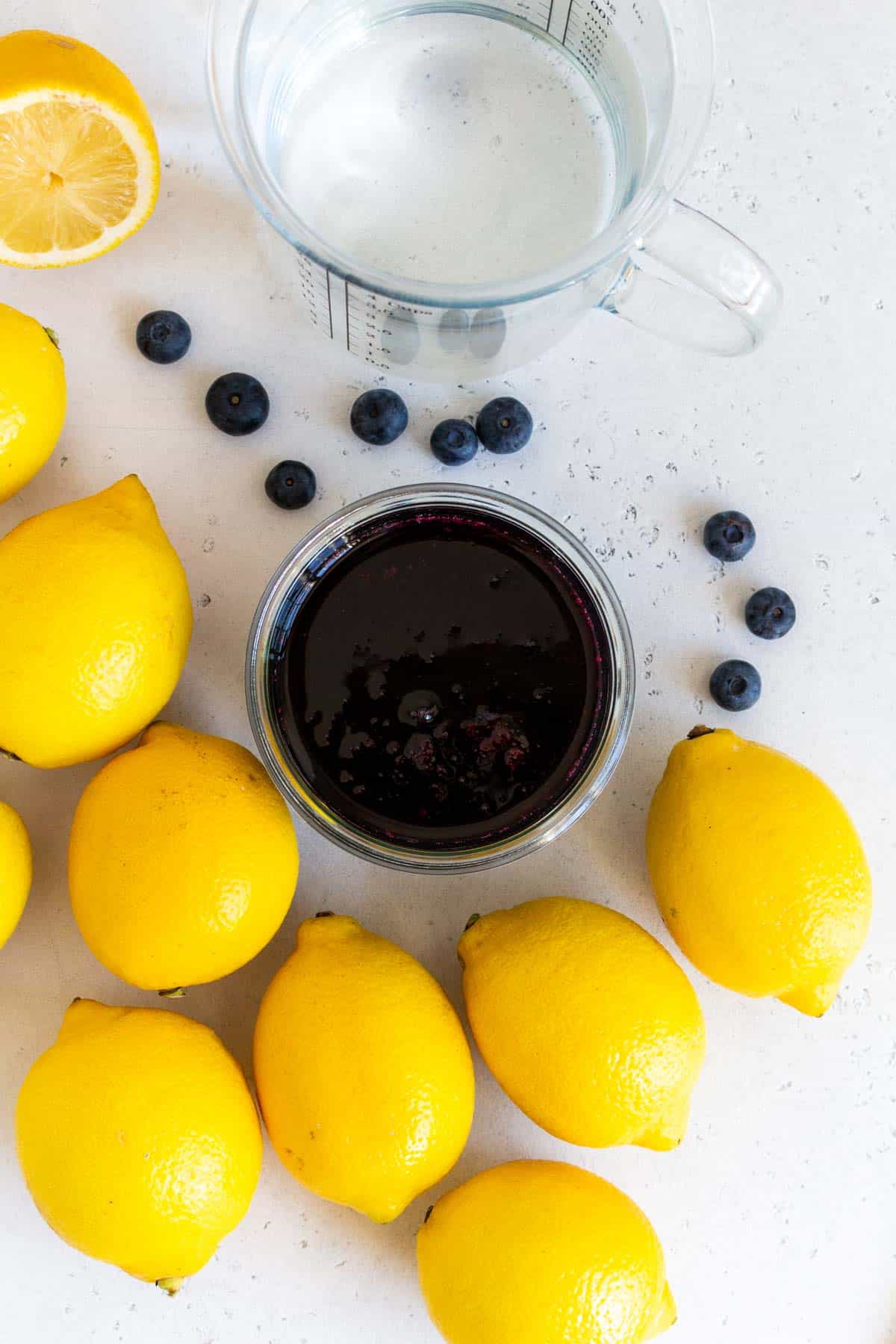 Ingredients needed to make blueberry lemonade.