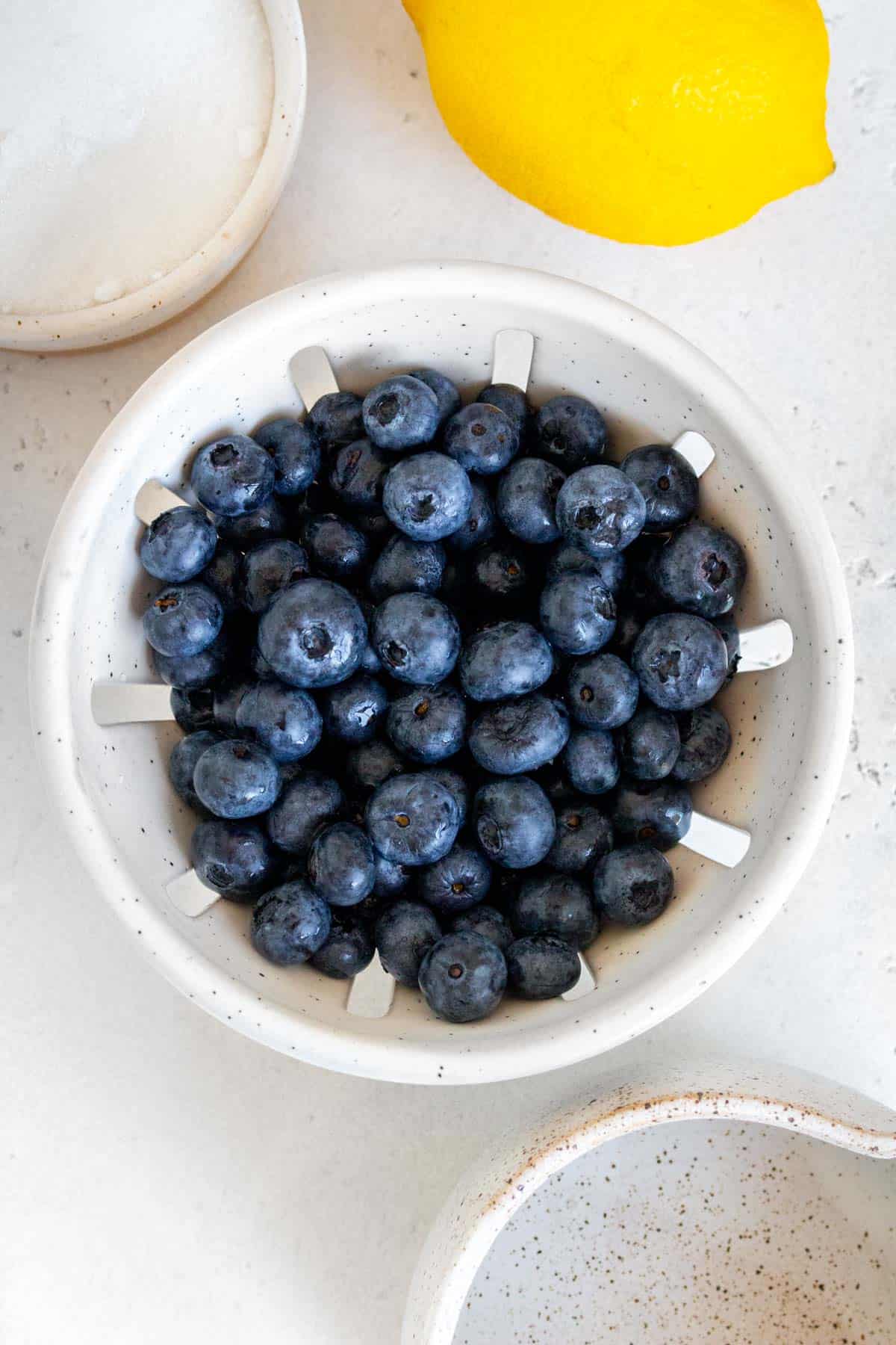 Ingredients needed to make blueberry simple syrup.