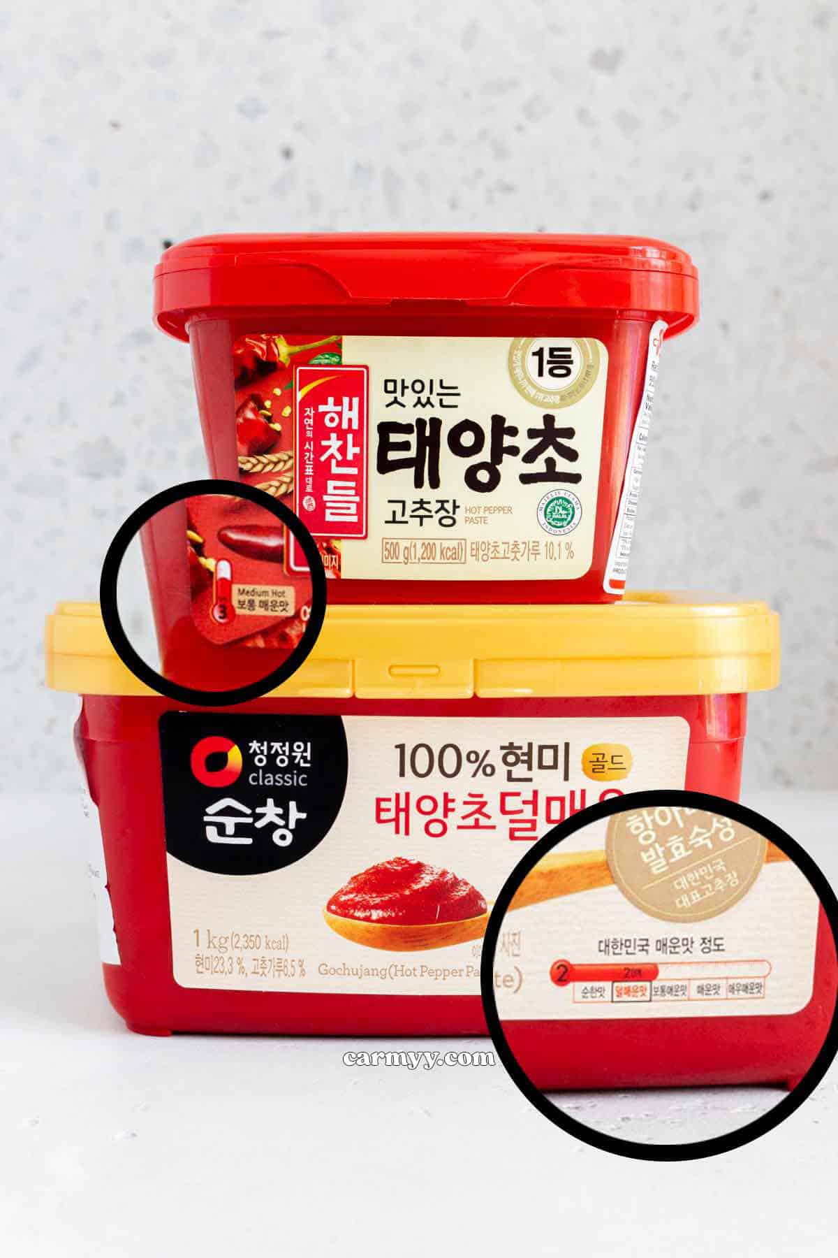 Two containers of gochujang.