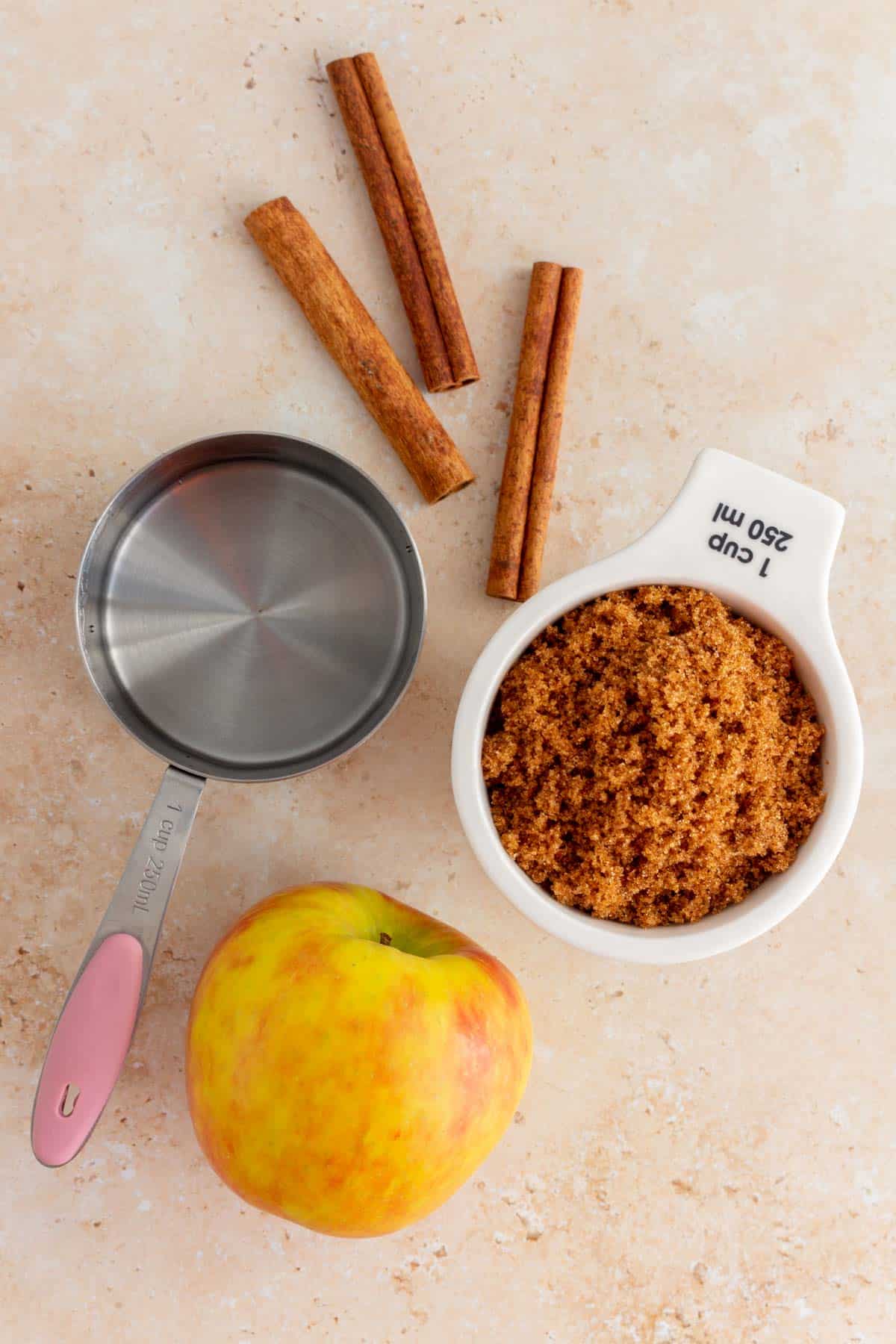 Ingredients needed to make apple brown sugar syrup.
