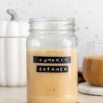 A nason jar of homemade pumpkin creamer.