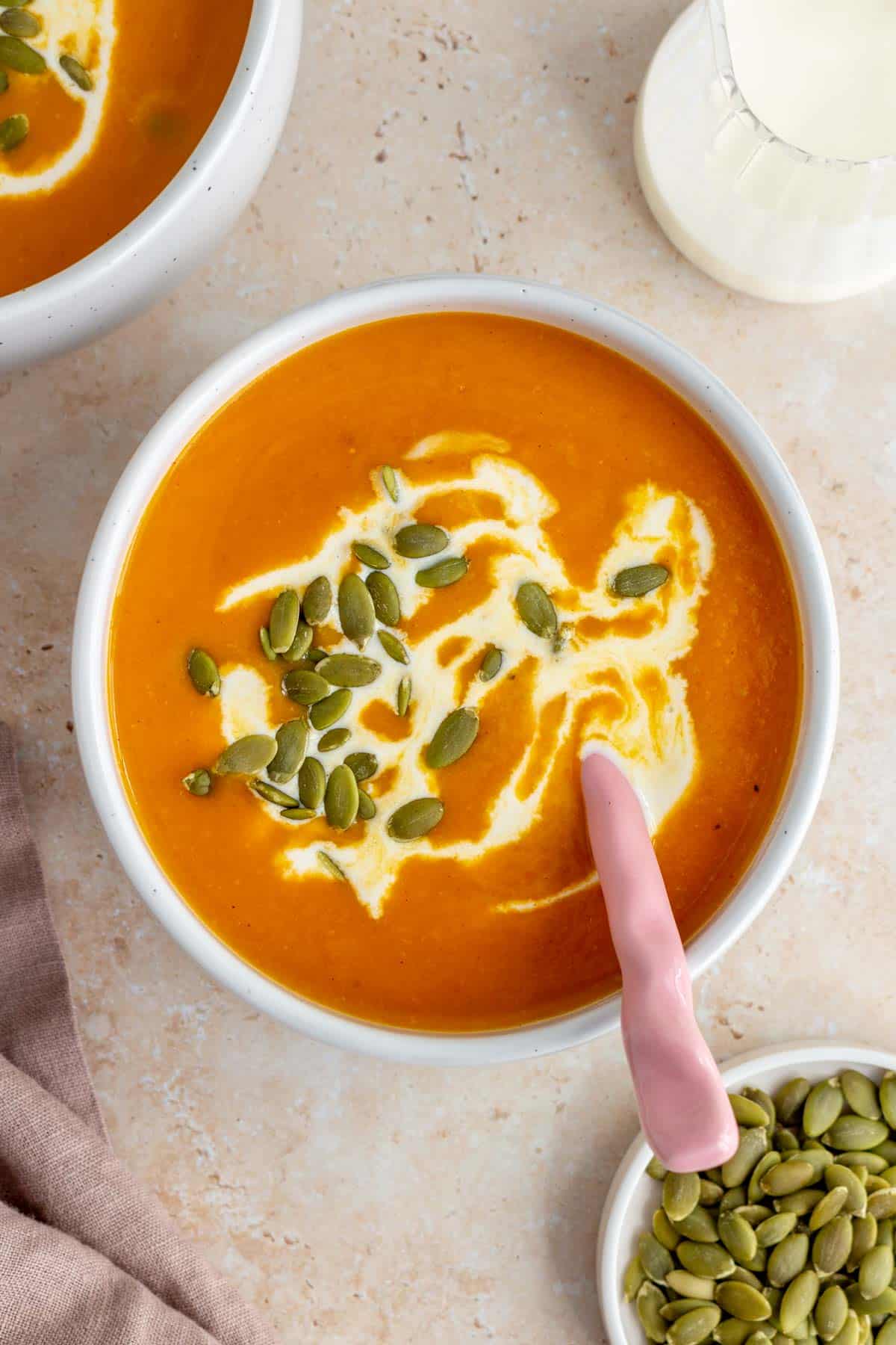a bowl of sweet potato and pumpkin soup.